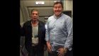 A British passenger posed for a photo with his alleged captor on a hijacked Egyptian plane on Tuesday. Image: Paul Smith/Twitter. 