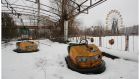 Chernobyl, 2006: Abandoned bumper cars and a never-used Ferris wheel in the centre of the empty city of Pripyat, 3km from the Chernobyl nuclear power plant. The Ferris wheel was to be opened on May 1st, 1986, but the explosion at the plant happened  on April 26th.  Photograph: Bryan O’Brien