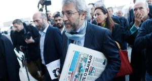 Can Dündar (centre) and Erdem Gül (left), journalists with the liberal Cumhuriyet newspaper,   arrive at Istanbul courthouse for their trial on Friday. They are accused of espionage and publicising state secrets. Photograph: Sedat Suna/EPA