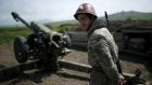 An ethnic Armenian soldier near Nagorno-Karabakh’s town of Martuni: two soldiers were killed by Azeri mortar fire today, separatist officials said. Photograph: Reuters