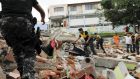Red Cross members, military and police officers: a major search for survivors begins as aid is expected from neighbouring countries after the earthquake struck off Ecuador’s Pacific coast. Photograph: Guillermo Granja/ Reuters