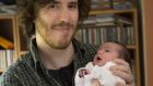 Writer, Joe Griffin and his (six day old) daughter Alice, at home in Cabra, Dublin.Photograph: Dara Mac Dónaill 
