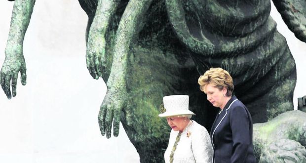  Queen Elizabeth II and  President Mary Mc Aleese at the Garden of Remembrance after their wreath laying ceremony as they walk past the scultpure by Oisin Kelly, the Children of Lir. Photograph: Cyril Byrne