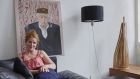 Nuala Goodman at home in Milan, under her portrait of Ettore Sottsass. Photograph: Carlo Lavatori