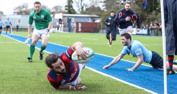 Clontarf’s Mick McGrath stretches to score a try during the Ulster Bank League Division 1A semi-final against UCD at  Castle Avenue. Photograph:  Gary Carr/Inpho