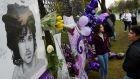 Prince fans beside a sea of purple balloons and flowers at a memorial wall outside the musician’s Paisley Park compound  in Minneapolis, Minnesota. File photograph: Mark Ralston/AFP/Getty Images