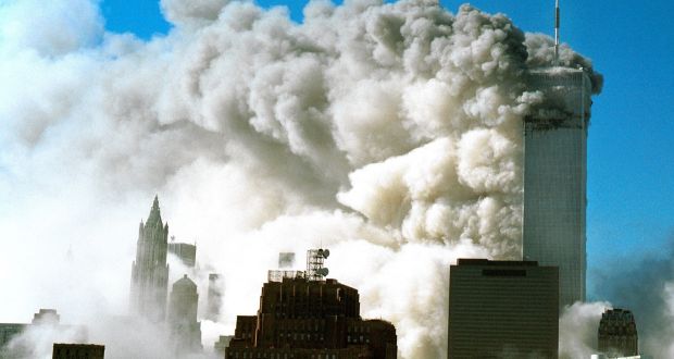 Smoke pours from the  World Trade Center in New York after it was struck by two planes during  the September 11th attacks in 2001: 15 of the 19 people involved in the attacks were Saudi citizens. Photograph: David Surowiecki/Getty Images