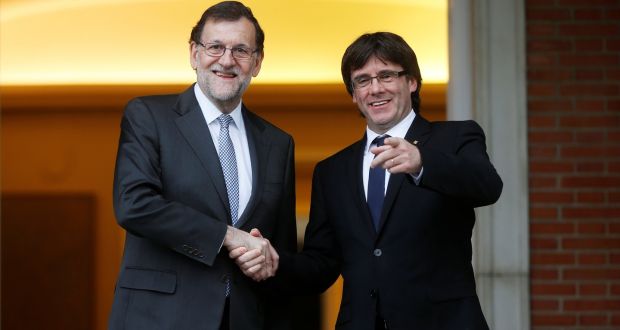 Acting prime minister Mariano Rajoy (left) and Catalan president Carles Puigdemont  at the Moncloa Palace in Madrid, Spain. Photograph: Susana Vera/Reuters