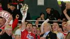 Cork’s Stephen Cronin lifts the provincial title following their win over Kerry in Tralee. Photograph: Ryan Byrne/Inpho