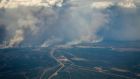Wildfires burn in and around Fort McMurray, Alberta, Wednesday, May 4th, 2016. Photograph: Jeff McIntosh/The Canadian Press via AP