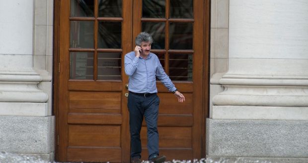 John Halligan: sat on the side of a  fountain with the Government Buildings behind him, looking conflicted. It reminded one of Princess Diana, when she sat on a bench with the Taj Mahal behind her. Photograph: Dave Meehan