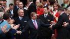 Newly elected Taoiseach  Enda Kenny is  congratulated as he leaves the Dail after becoming the first Fine Gael leader to be re-elected as Taoiseach. Photograph: The Irish Times 