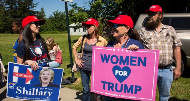 Supporters hold signs, hours before Donald Trump’s campaign rally at the Northwest Washington Fairgrounds in Lynden, Washington, last weekend: the businessman has a massive negative rating among women. Photograph: David Ryder/The New York Times