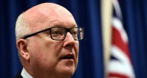Australia’s Attorney-General George Brandis speaks during a press conference in Brisbane on Sunday. Mr  Brandis commented on charges laid against five men who allegedly wanted to use a small boat to reach Indonesia and then to join the so called Islamic State terrorist group  in Syria. Photograph: EPA