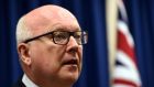 Australia’s Attorney-General George Brandis speaks during a press conference in Brisbane on Sunday. Mr  Brandis commented on charges laid against five men who allegedly wanted to use a small boat to reach Indonesia and then to join the so called Islamic State terrorist group  in Syria. Photograph: EPA