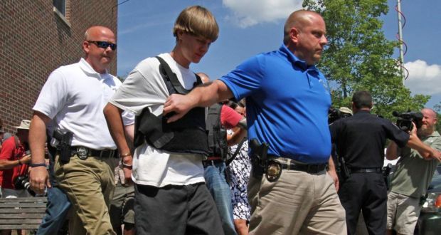 Dylann Roof (C) is accused of opening fire on June 17th, 2015, during Bible study at Charleston’s historic Emanuel African Methodist Episcopal Church in a massacre that killed nine people. Photograph: AP Photo/Chuck Burton