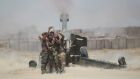 Shia fighters take a selfie while firing artillery towards Islamic State militants near Falluja, Iraq, on Sunday. Photograph: Alaa Al-Marjani/Reuters