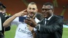 Karim Benzema  poses with Marcel Desailly following the Champions League final between Real Madrid and Atletico Madrid at the San Siro. Photograph: Jean Catuffe/Getty Images