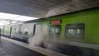 The smoking train carriage is seen at Clongriffin station on Tuesday morning. Photograph: Paddy Logue/The Irish Times 