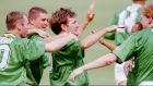 The Republic of Ireland’s Ray Houghton (C) is mobbed by his teammates after scoring in  the World Cup match between Italy and Ireland in East Rutherford New Jersey on June 19th, 1994. Irish super fan Jim Ryan, who has followed the team around the world, says Houghton’s goals in 1994 and against England in 1988 are some of his most memorable moments.  Photograph: Ray Stubblebine/Reuters.