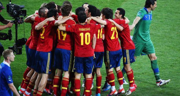 Spanish  players celebrate victory over Italy in the 2012 UEFA European Championship final in Kiev, Ukraine, as Italian goalkeeper Gianluigi Buffon  walks by. Photograph:  Martin Rose/Getty Images