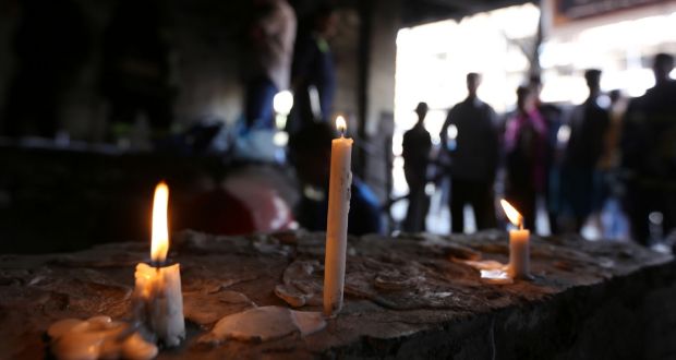 Candles at the site of a suicide-bombing attack which took place two days earlier in Baghdad’s Karrada neighbourhood. Photograph: Sabah Arar/AFP/Getty Images