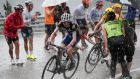 Ireland’s Daniel Martin and Britain’s Christopher Froome, wearing the overall leader’s yellow jersey ride under the rain as fans cheer during the 184,5 km ninth stage of the 103rd edition of the Tour de France. Photograph: Getty Images