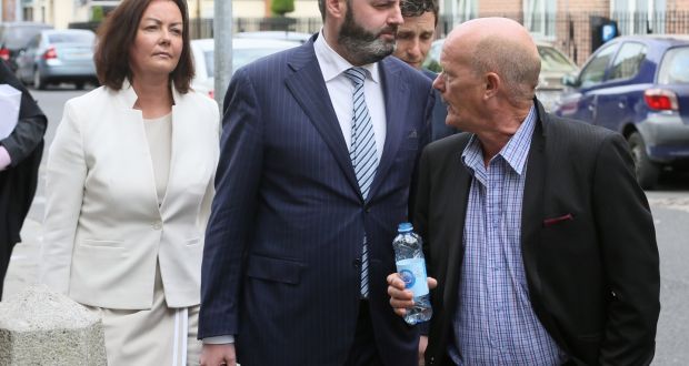 Deirdre Foley, owner of D2 Private is shouted at by former Clery’s worker John Crowe (with water bottle) as she leaves the High Court. D2 Private is part of the Natrium consortium which bought Clerys.   Photograph: Collins