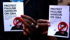 Protesters in Sydney, Australia, with pamphlets of One Nation leader Pauline Hanson during a rally organised to show support for the Black Lives Matter movement in the US. Photograph: David Gray/Reuters