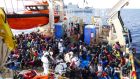 Some of the 352 Eritrean migrants rescued from a small wooden boat recover on the deck of the Malta-based Responder, a search-and-rescue vessel operated by Migrant Offshore Aid Station (MOAS). Photograph: Adam Alexander