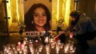 Candles are lit  at the vigil at Eyre Square in Galway to mark the first anniversary of the death of Savita Halappanavar. Photograph: Joe O’Shaughnessy. 