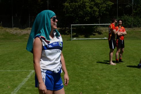 Sarah Fetterlya a  Munich player  protects herself from the sun.
All photographs: Cyril Byrne