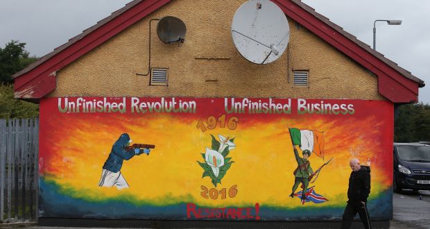 A man walks past a newly painted Republican mural commemorating the 1916 Easter Rising in the Creggan area of Derry. Photograph: Brian Lawless/PA Wire