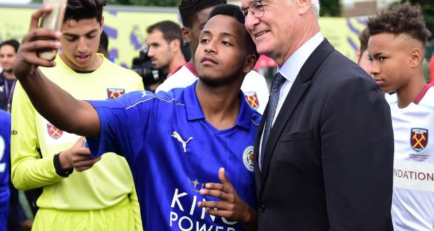  Claudio Ranieri, manager of Leicester City poses for a selfie photograph with a young player during the Official Premier League Season Launch Media Event held at Market Road pitches on August 10, 2016 in Islington, England. Photograph: Alex Broadway/Getty Images