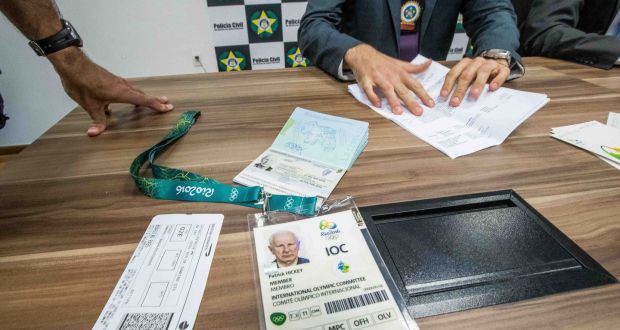 Olympic Council of Ireland president Pat Hickey’s passport and accreditation on show during a Police press conference. Photograph: INPHO/Morgan Treacy