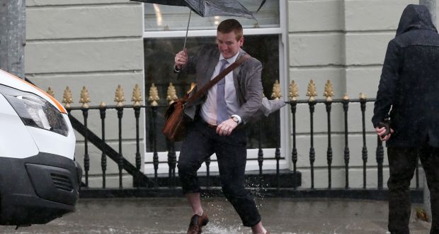 Caught in a torrential downpour on Parkgate Street in Dublin. Photograph: Laura Hutton/Collins Photo Agency