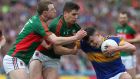Mayo’s Colm Boyle and Lee Keegan tackle Tipperary’s Michael Quinlivan. There is a price to pay for taking all those tackles. Every heavy hit softens you up to some extent. Photograph: Lorraine O’Sullivan/Inpho