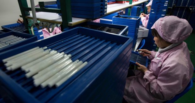 Employees check electronic cigarettes at a production line in a factory in Shenzhen, southern Chinese province of Guangdong. Photograph: Tyrone Siu/Reuters