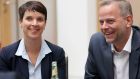 Frauke Petry, chairwoman of AfD, with party candidate Lief-Erik Holm: said the coalition partners were damaging themselves by refusing to listen to the public. Photograph: Wolfgang Kumm/EPA