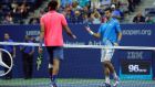 Jo-Wilfried Tsonga of France greets Novak Djokovic of Serbia at the net after Tsonga was forced to retire due to injury in their 2016 US Open quarter-final. Photograph: Getty Images