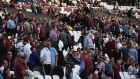 Fans leave their seats before full time at London Stadium. Photograph: Mike Hewitt/Getty Images