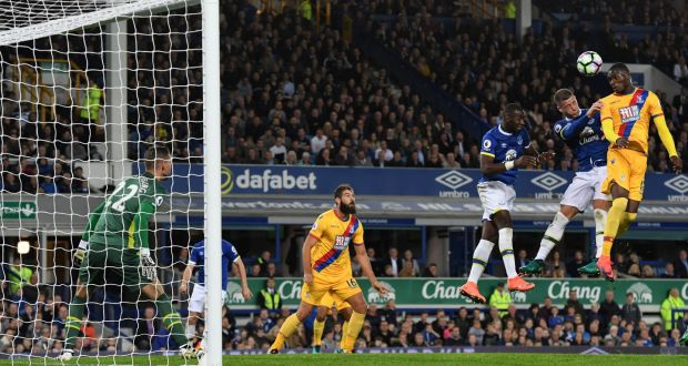 Christian Benteke rises to score Crystal Palace’s equaliser against Everton at Goodison Park. Photograph: Reuters