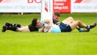 UCD’s Jimmy O’Brien scores a try against Terenure. Photo: Tommy Dickson/Inpho
