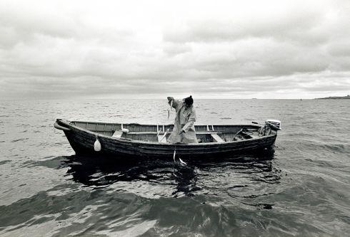 Local fisherman Joe Lawless hauling mackerel off Bulloch Harbour, Dalkey in 1985.  Photograph: Eric Luke
