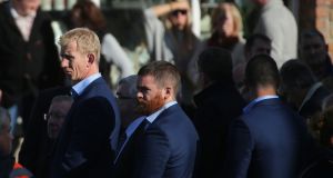 Leinster Head Coach Leo Cullen (left) watches as the coffin of the late Munster head coach Anthony Foley is brought into  St Flannan’s Church, Killaloe in Co Clare, ahead off his funeral tomorrow. Photograph: Niall Carson/PA Wire.