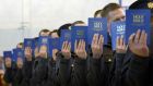 Garda Reserve recruits  take their oaths: numbers peaked at  1,162 members in 2013 but have  since declined to 789 members. Photograph: Brenda Fitzsimons/The Irish Times
