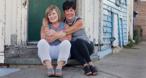 Friends Kim Camillo  and Patty Sullivan on a corner in the South Boston neighborhood where they grew up together. Photograph: Kael Alford/Panos Pictures