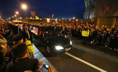 Crowds line the street as a hearse carrying the coffin of former Shannon and Munster player Anthony Foley passes Thomond Park. Photograph: Niall Carson/PA Wire 
