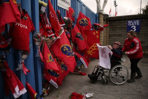 Munster Rugby fan Anna O'Neill (left) pays tribute to Anthony Foley outside Thomond Park. Photograph: Niall Carson/PA Wire 
