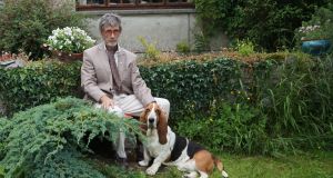  PJ Tynan in his garden with his dog Edgar Linton, named after a character in Wuthering Heights